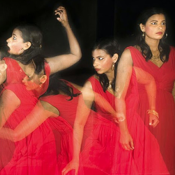 Radhika Rao in a promotional image for the play Cock. A multiple exposure image depicting Rao in multiple poses wearing a red dress.