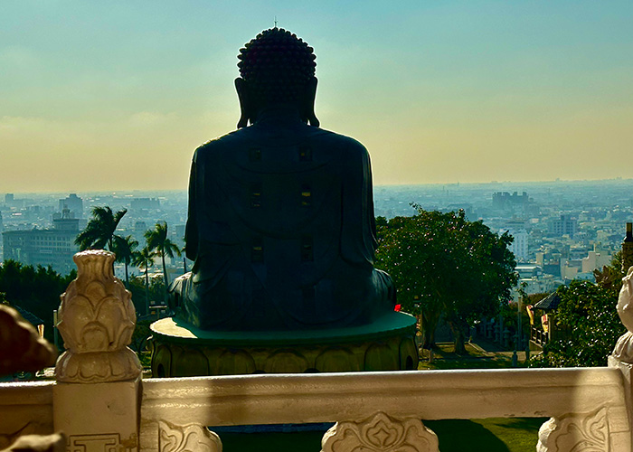 Backlit statue of Buddha