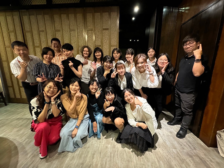 Group of people posing for photograph