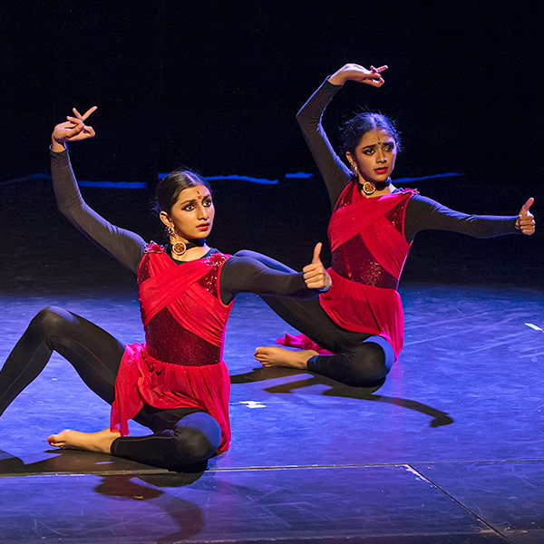 Two dancers in red costume