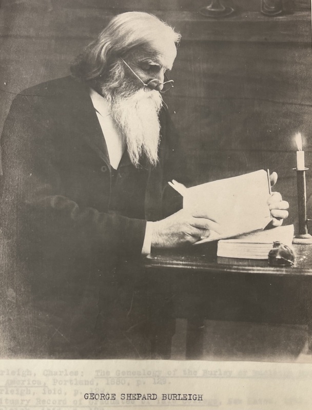 George S. Burleigh seated at a Desk and Working