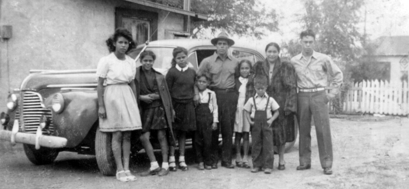 Fernando Chavez and family, standing by car 1930s 