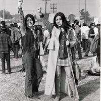 Protest Against Vietnam War / LA Moratorium (Two women at the LA Moratorium raising their right fists in solidarity)