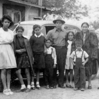 Fernando Chavez and family, standing by car 1930s 