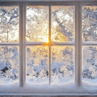 Frosty Winter Scene through Window Pane at Sunrise